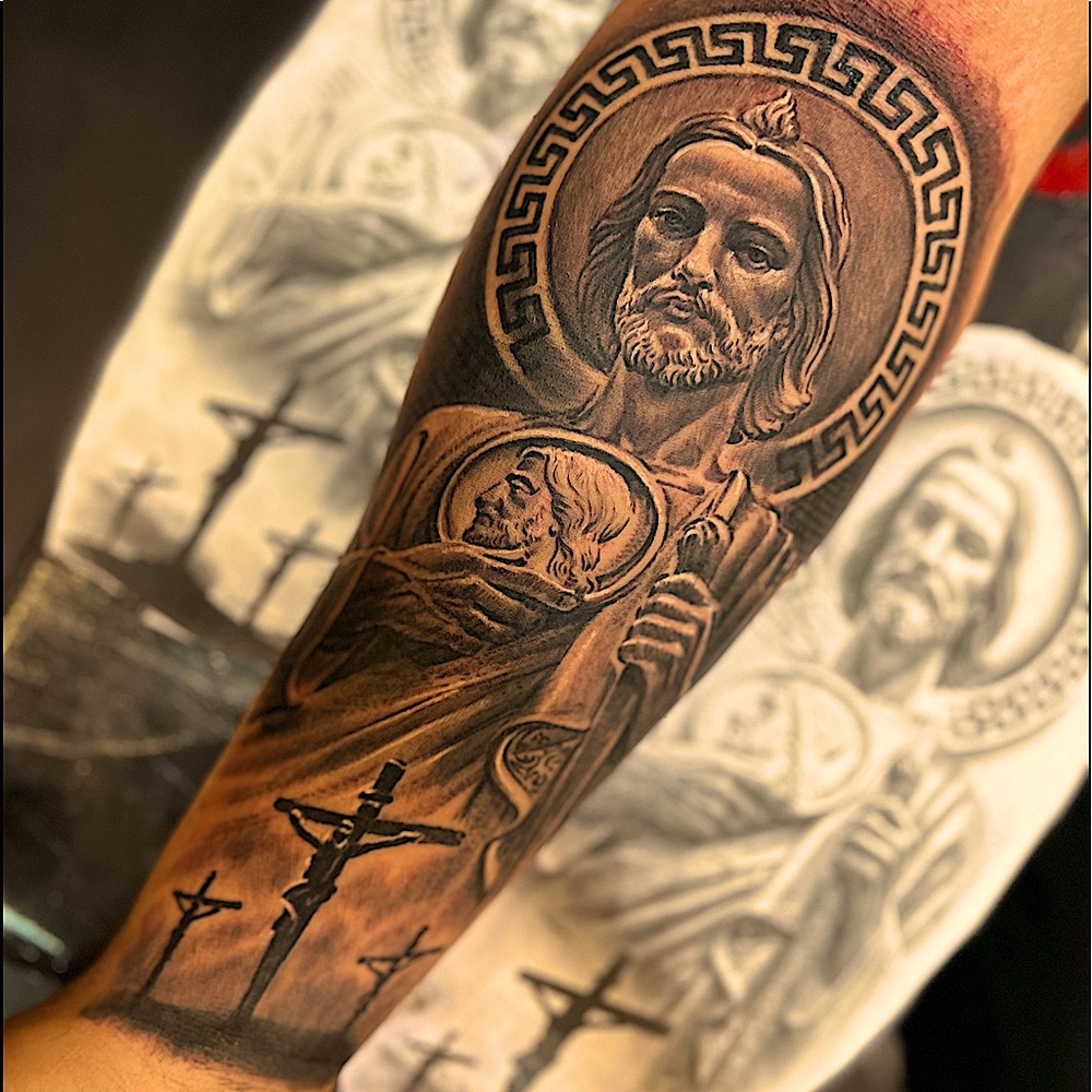 Black and gray realism Tattoo covering the forearm.